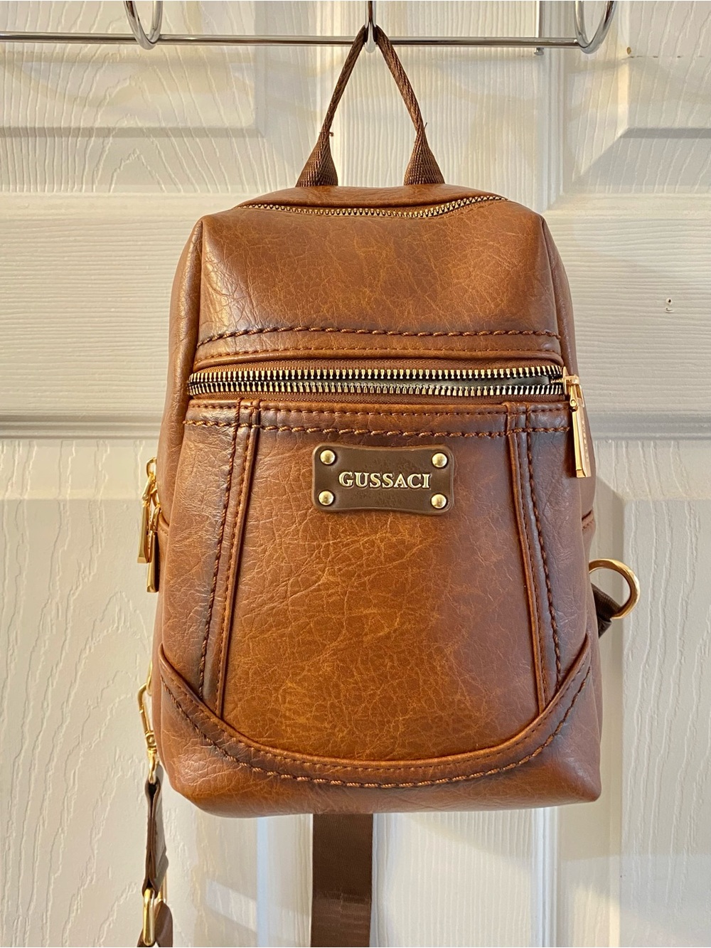 GUSSACI Sling Backpack NEW, Never Used, clean, no wear and tear, 10 by 11 inches